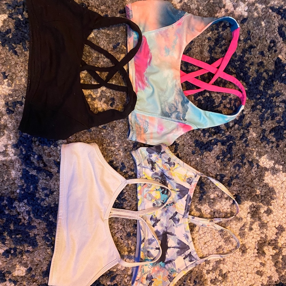 Four Ivivva sports bras, EACH originally $15, sold TOGETHER for $20